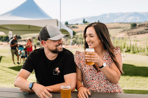 A couple enjoying craft beer at Cowiche Creek Brewing Company.
