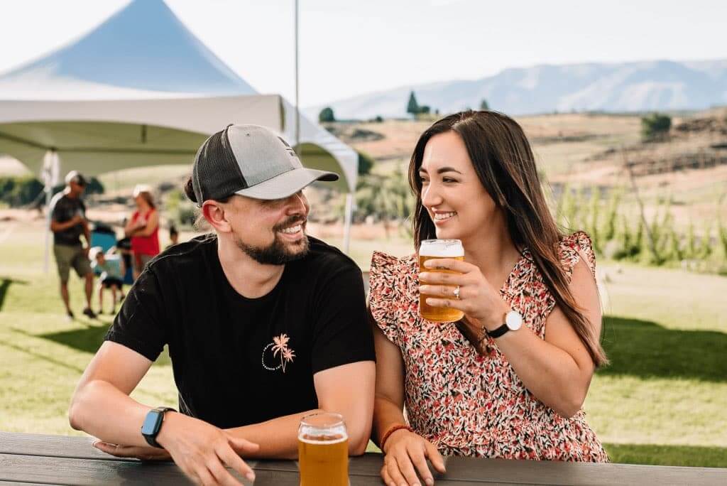 A couple sits in the outdoor area at Cowiche Creek Brewing Company in Yakima, WA.