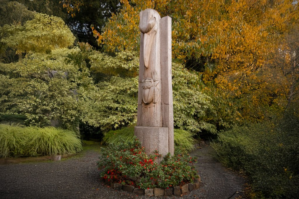 A totem pole stands in Heronswood Garden